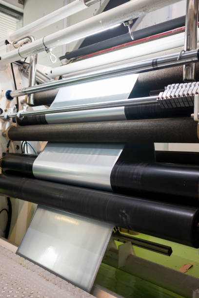 istock plastic film rolls inside plastic and aluminium food packaging making machine inside factory 1187088260