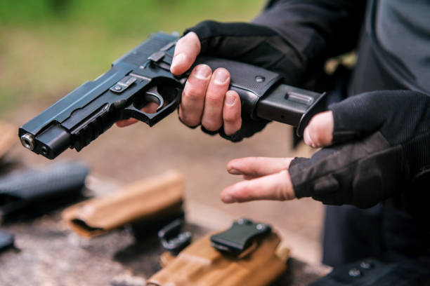 istock sports shooting instructor check your weapons close-up 1187089089