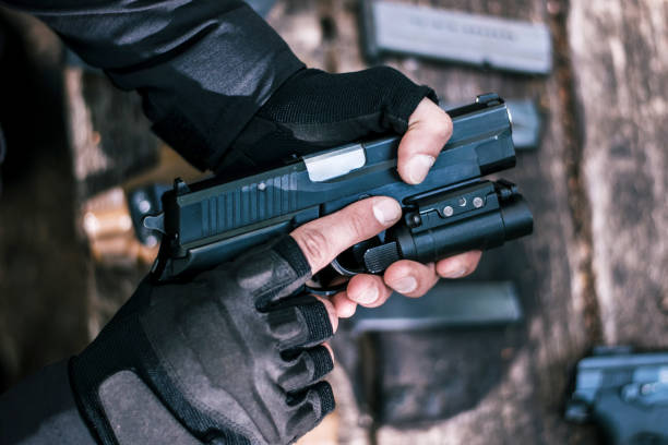 istock sports shooting instructor check your weapons close-up 1187089179