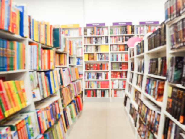 istock Blurred books on the shelf in public library. Blurred effect. 1187091058
