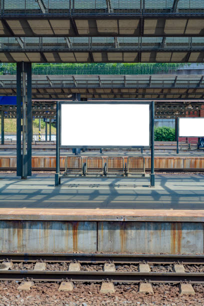 istock Platform of the railway station with empty board 1187093718