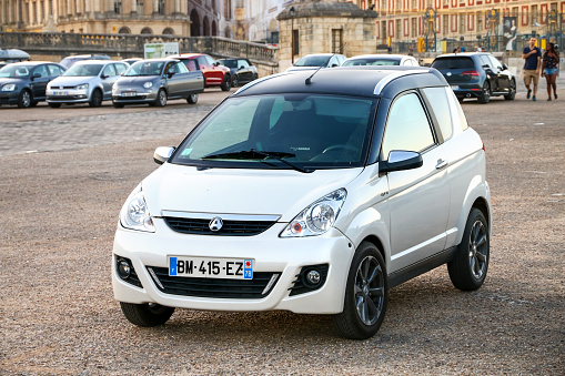 Versailles, France - September 15, 2019: Tiny city car Aixam Crossline in the city street.