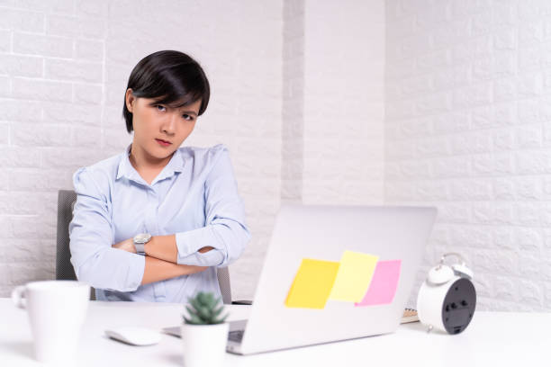 istock Angry woman working at office 1187096823