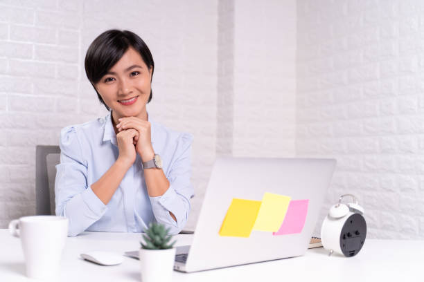 istock Happy woman sitting at home office working using computer laptop 1187097896