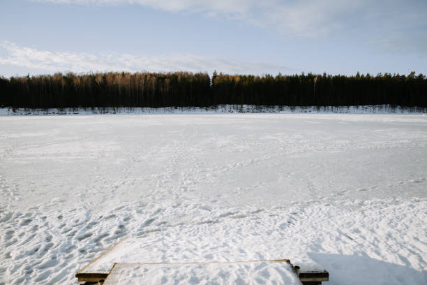 istock Snow covered lake with pier, winter landscape. 1187098133