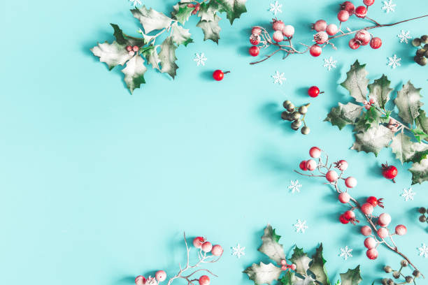 istock Christmas composition. Frame made of christmas plants on blue background. Flat lay, top view, copy space 1187099832