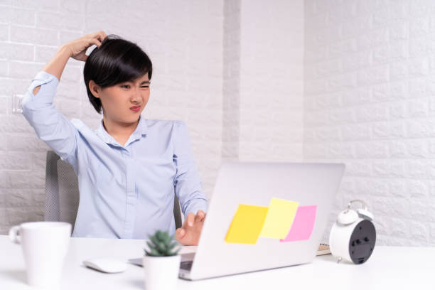 istock Woman scratching her head at office 1187100009
