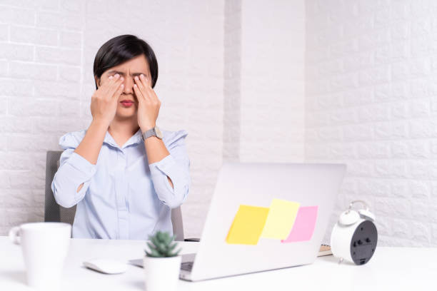 istock Woman has eyes pain at office 1187100201