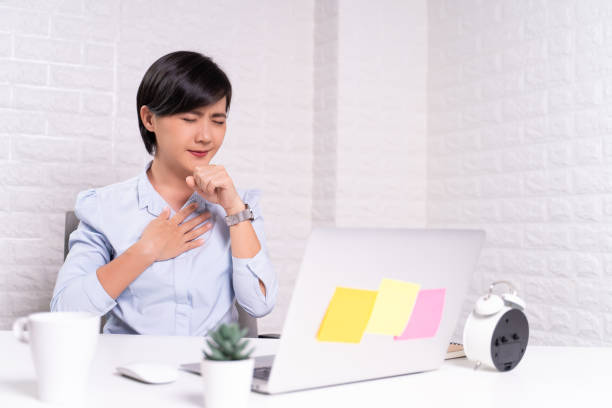 istock Sick woman at office with fever 1187101061