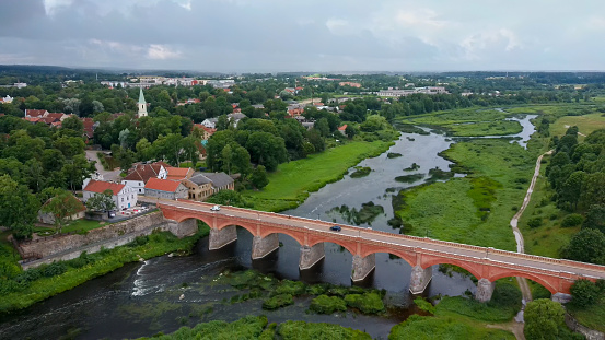 the Widest Waterfall in Europe in Latvia Kuldiga and Brick Bridge Across the River Venta in the Evening