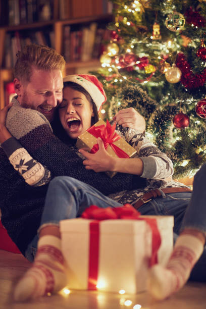 istock couple in love with Christmas present 1187102941