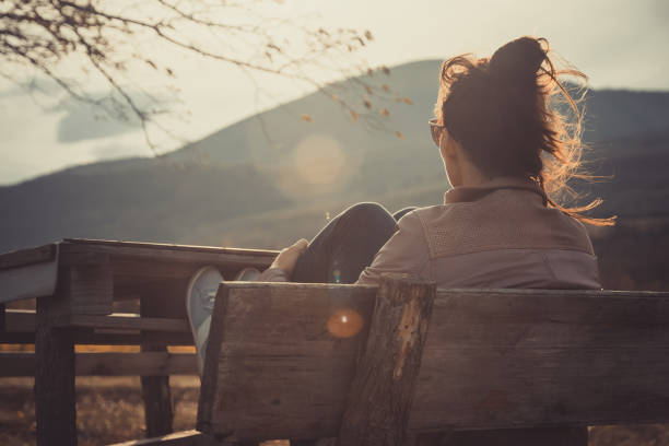 istock Woman enjoying sunset. 1187105273