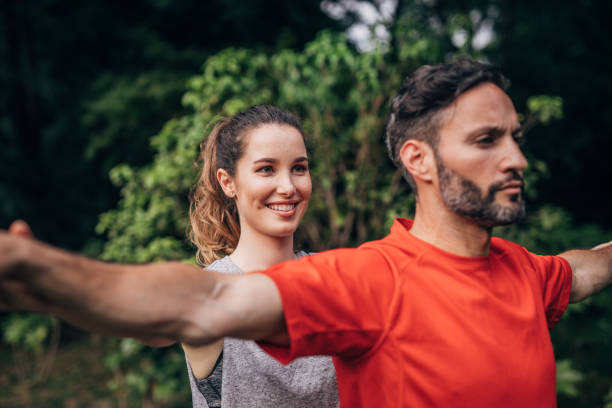 istock Couple training together in park 1187105660