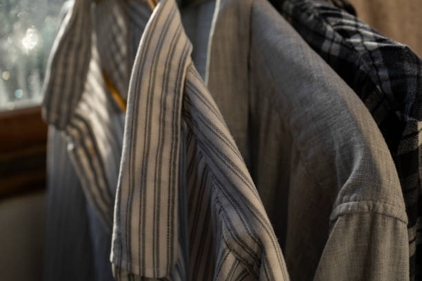 istock Shirts hanging on the shoulders 1187106821
