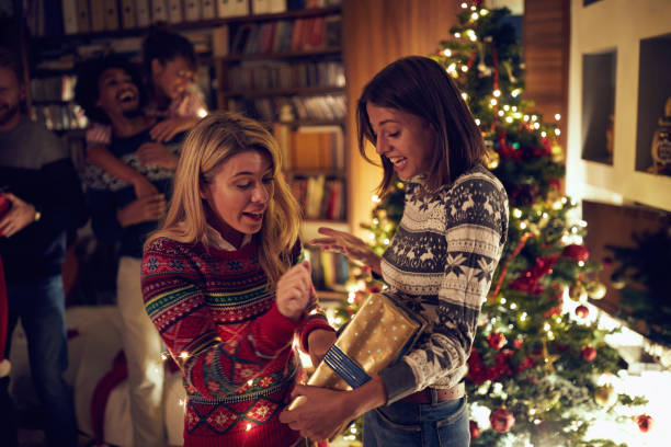 istock friends opening Christmas presents 1187107135