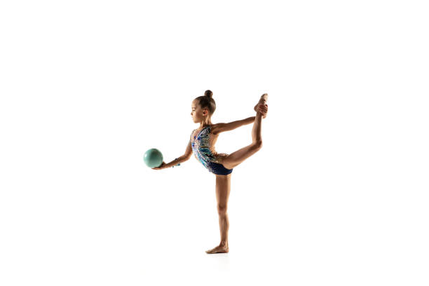 istock Little flexible female gymnast isolated on white studio background 1187108216