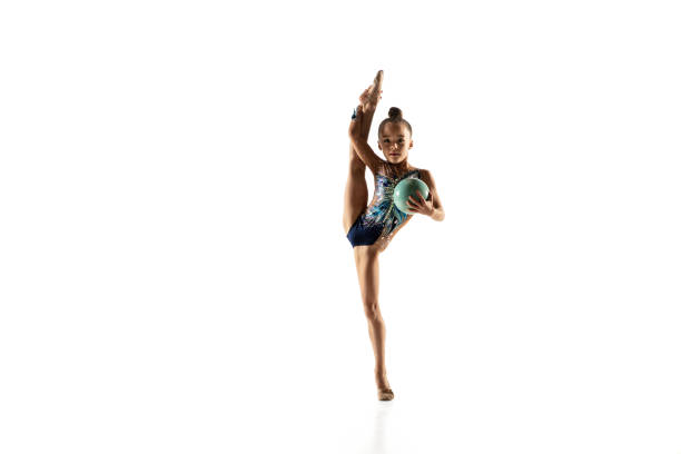 istock Little flexible female gymnast isolated on white studio background 1187108218