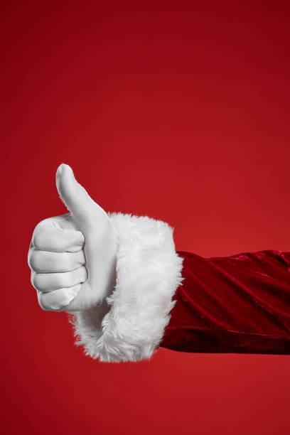 Man showing thumb up Close-up of man in white glove showing thumb up isolated on red background ok sign photos stock pictures, royalty-free photos & images