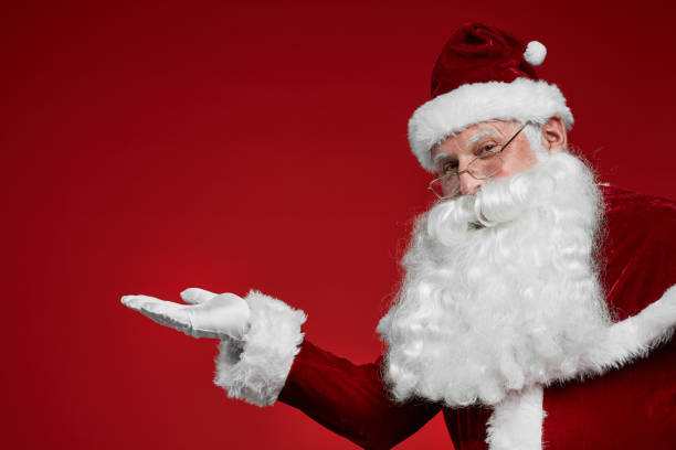 istock Santa Claus gesturing welcome sign 1187110100