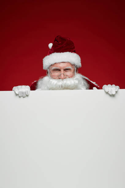 istock Santa Claus with white billboard 1187111387