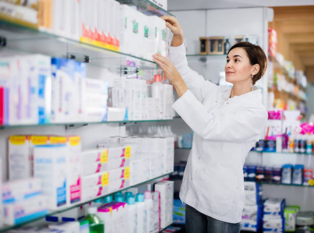 istock Female pharmacist suggesting useful body care products 1187111446