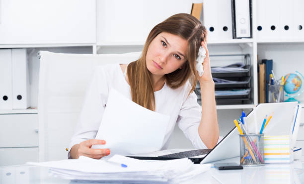 istock Frustrated young entrepreneur at office desk 1187111771