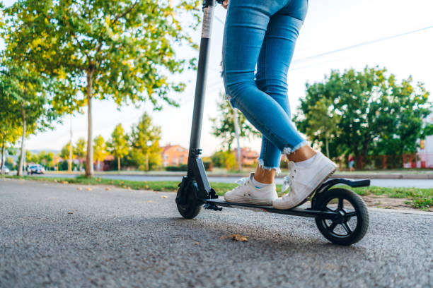 istock Female on electric scooter 1187113209