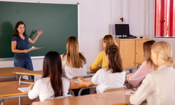 istock Female teacher lecturing to students 1187113393