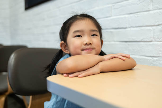 istock Smiling girl in the restaurant 1187115101