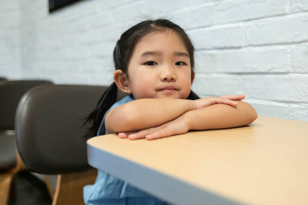 istock Smiling girl in the restaurant 1187115106