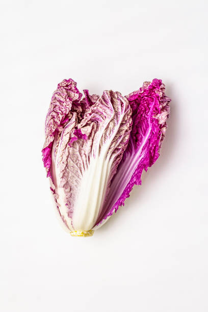 istock Ripe single purple Napa (chinese) cabbage. Fresh whole head of cabbage. Isolated on white background 1187115143