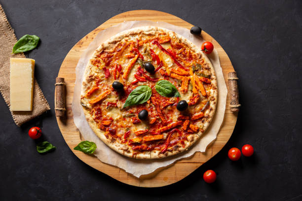 istock chicken tomato pepper pizza with olives and basil, top-view 1187116072