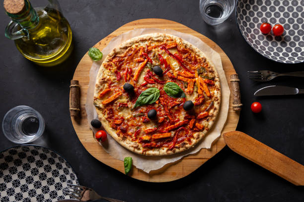 istock table with pizza ready to serve, top-view 1187116109