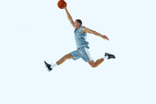 istock Young caucasian basketball player against white studio background 1187122415