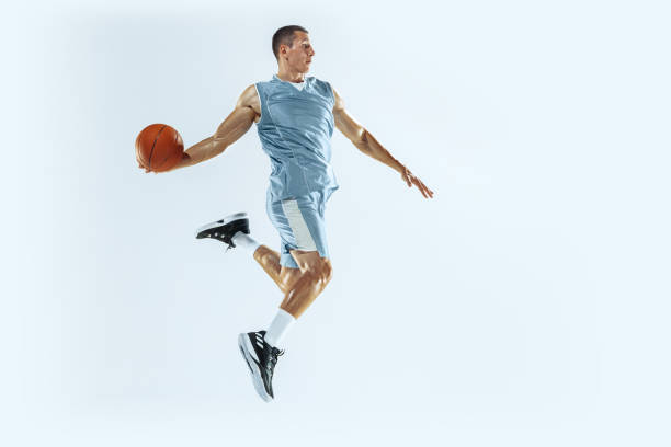 istock Young caucasian basketball player against white studio background 1187122419
