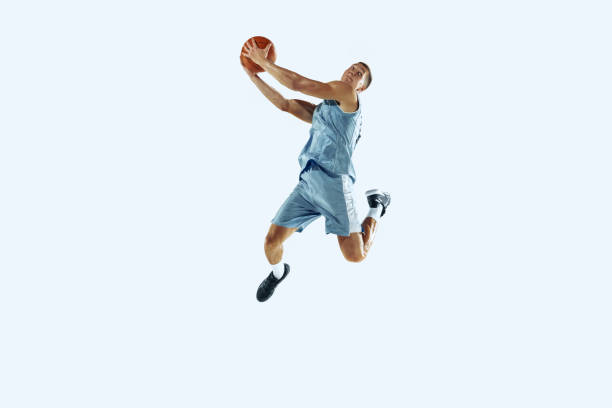 istock Young caucasian basketball player against white studio background 1187122450