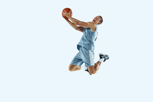 istock Young caucasian basketball player against white studio background 1187122456