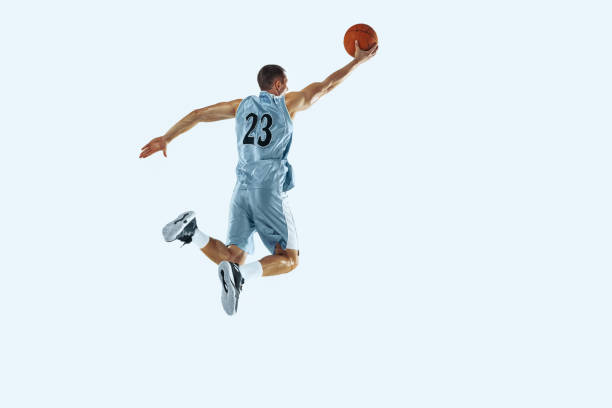 istock Young caucasian basketball player against white studio background 1187122458