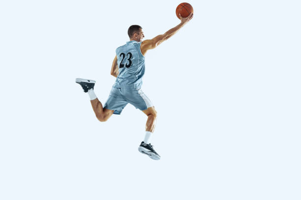 istock Young caucasian basketball player against white studio background 1187122459