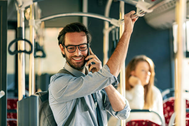 istock Young man traveling with bus and using smart phone 1187122759
