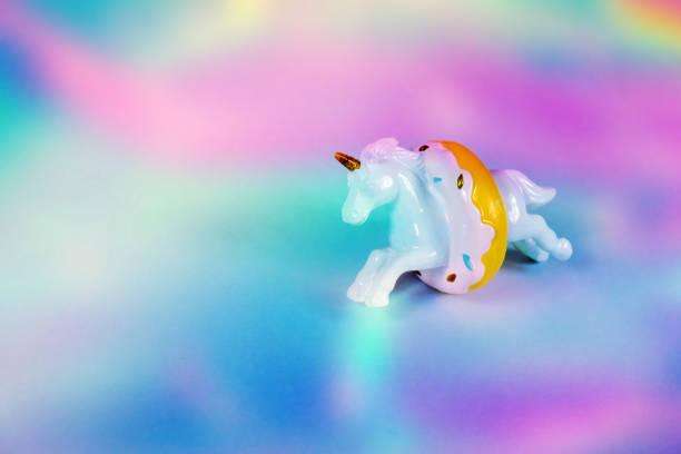 istock Unicorn horse jumping through a donut 1187122853