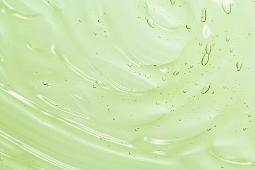 Fondo de textura de gel cosmético de aloe vera verde photo