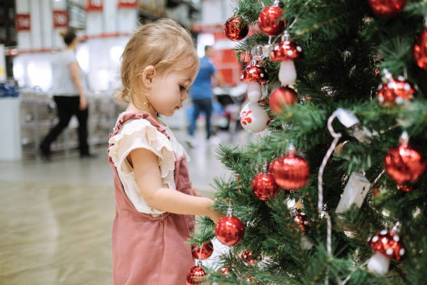 istock Decorating Christmas Tree with Ornaments and Christmas Lights 1187126976