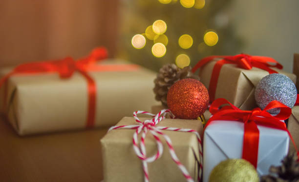 istock Gift boxes and christmas ball ornament on table at home 1187139878