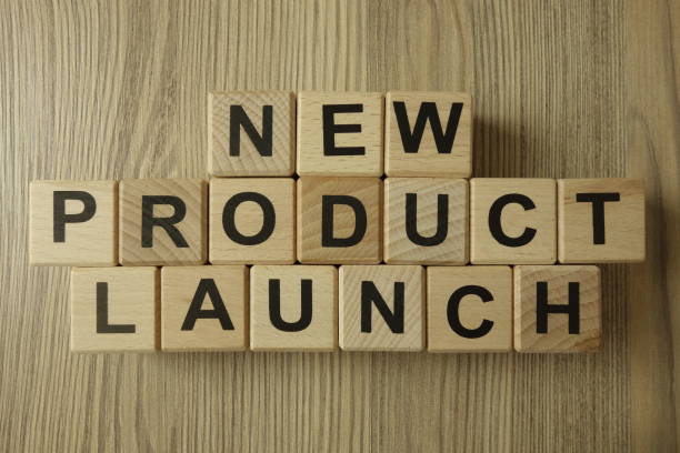 New product launch text from wooden blocks New product launch text from wooden blocks on desk launch event photos stock pictures, royalty-free photos & images