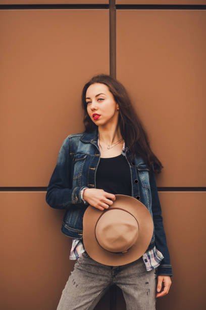 istock young brunette woman posing 1187142558