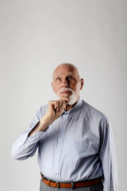 istock Old man is full of doubts and hesitation. 1187142600