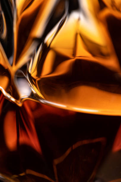 close-up whiskey glass detail of an alcoholic beverage - cognac bottle imagens e fotografias de stock