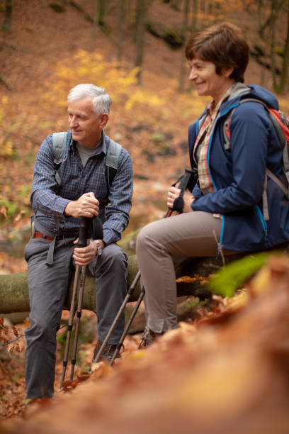 istock Senior couple going hiking in forest on mountain 1187143805