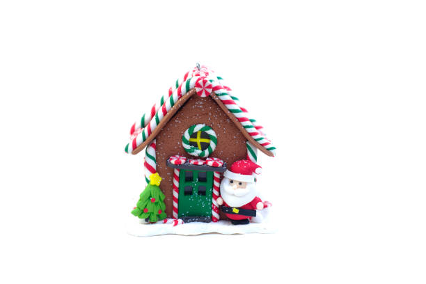 istock Christmas gingerbread house with santa claus and christmas tree, isolate 1187144085